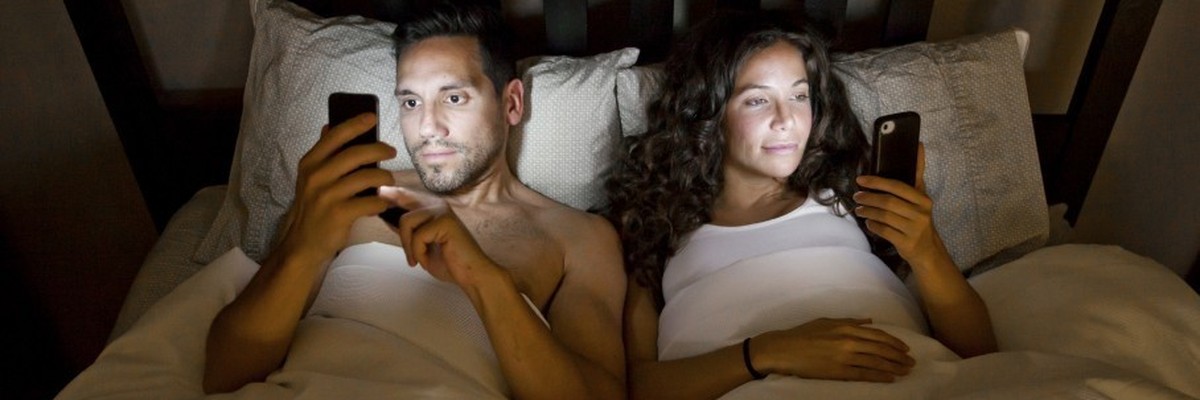 couple both on their phone