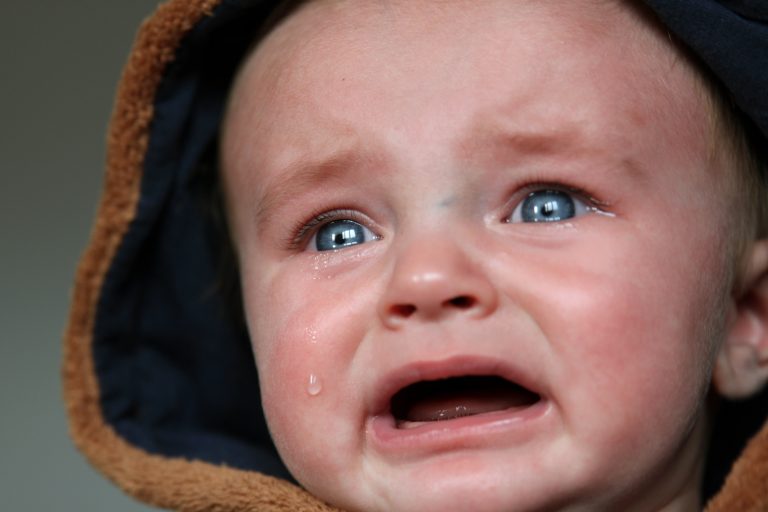 crying baby showing how to deal with stubborn kids