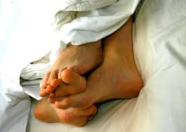 couple in bed showing uses for dildos and wands in marriage