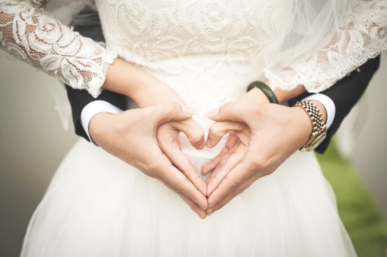 hands making a heart showing things to think about before marriage