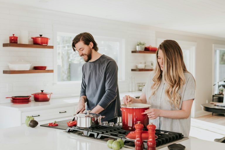Husband and wife together in a busy kitchen