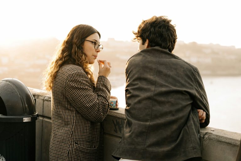 Husband and wife standing together talking