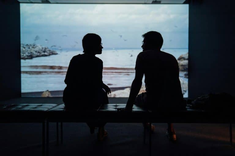 Silhouette of a husband and wife sitting together