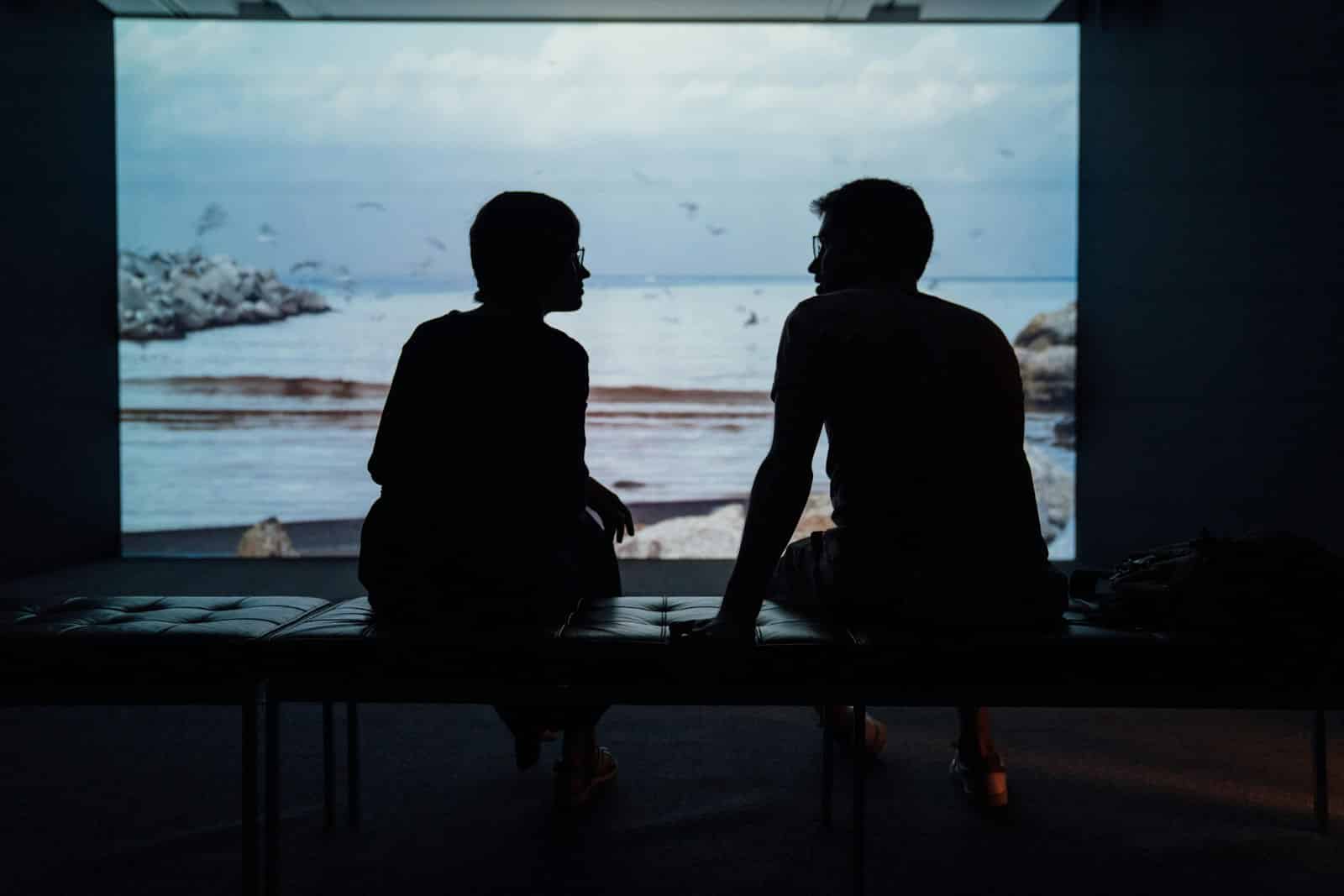 Silhouette of a husband and wife sitting together