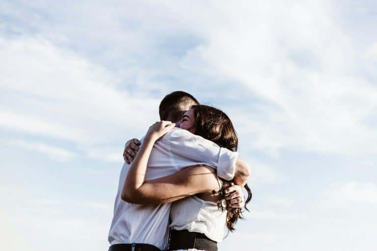 Husband hugging his wife