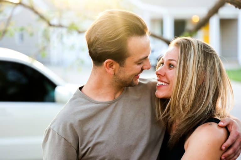 Husband kissing his wife