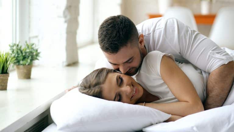 Newlywed couple relaxing together at home