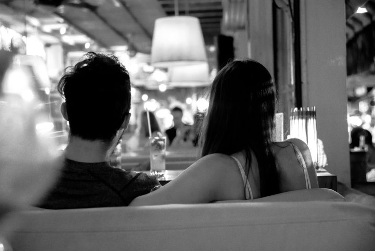 Couple sitting close together having an honest conversation