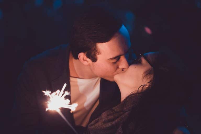 Husband and wife sharing a kiss