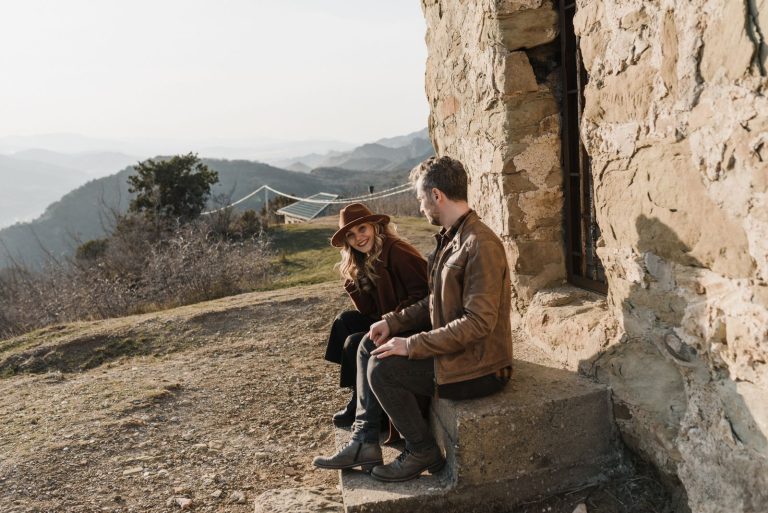 Couple holding hands while walking on a scenic path