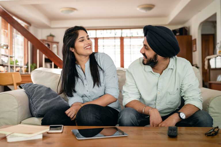 Married couple laughing and flirting with each other