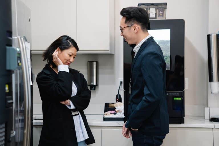 Husband and wife talking in their kitchen at home
