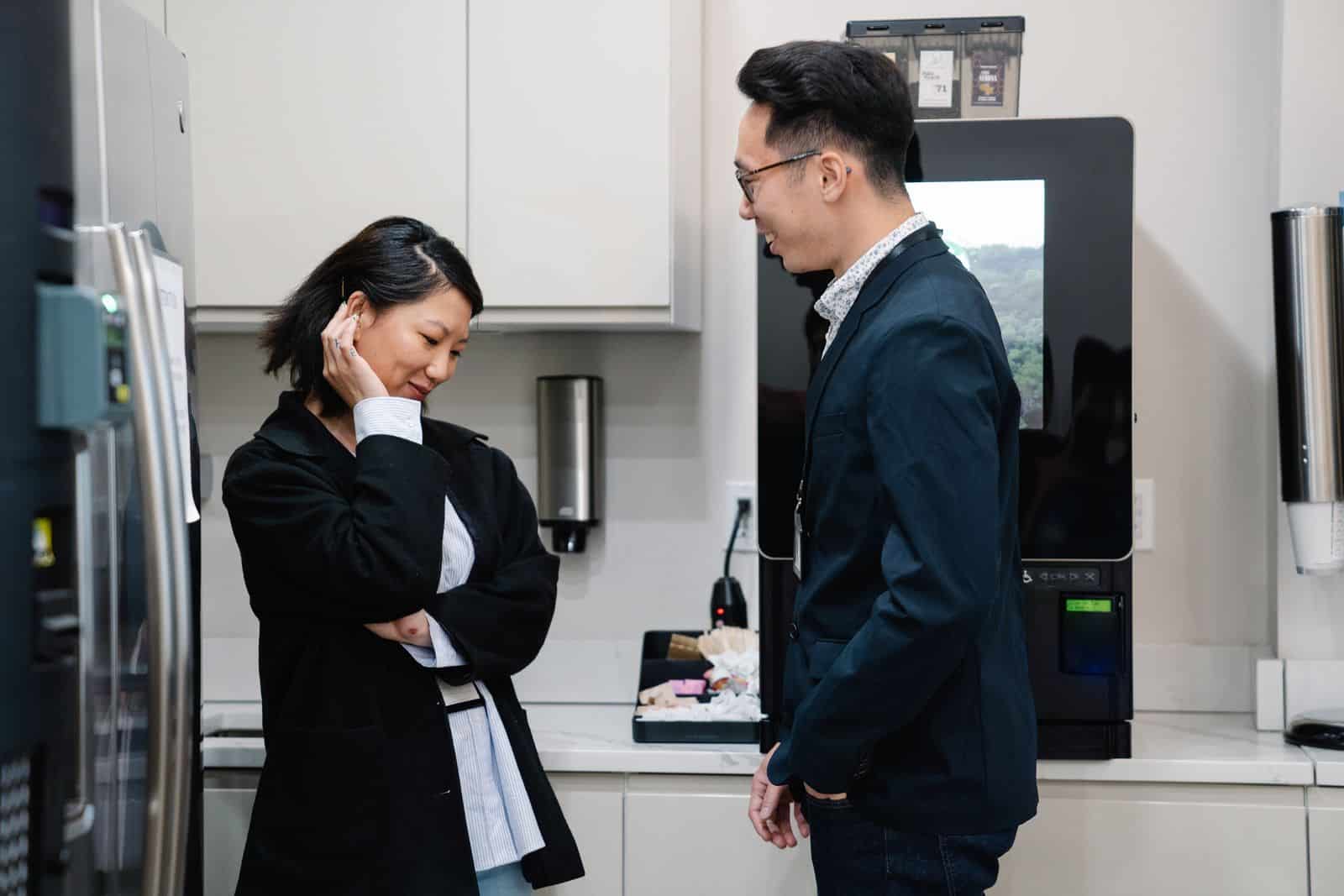 Husband and wife talking in their kitchen at home