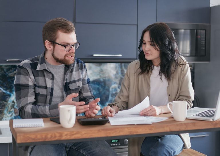 Couple at home talking about who does more around the house